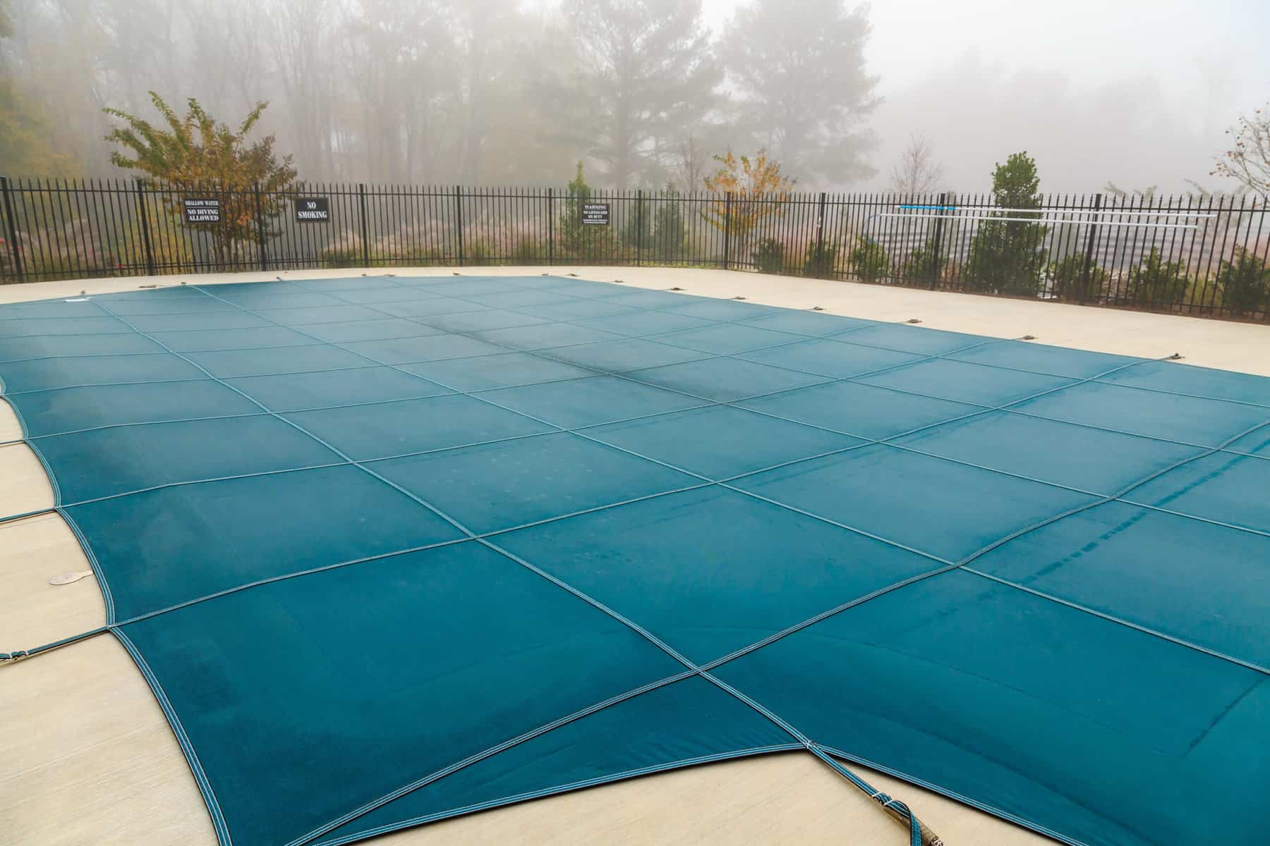 A Blue Vinyl Pool Cover in Fog